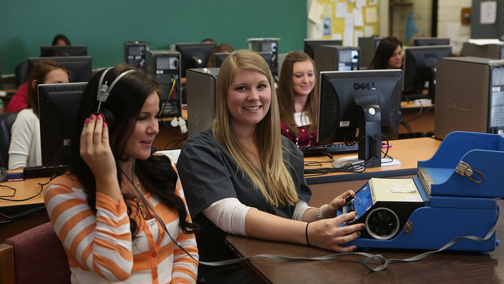Cal U students use hearing testing equipment.