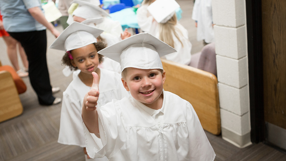 Children graduate from preschool.