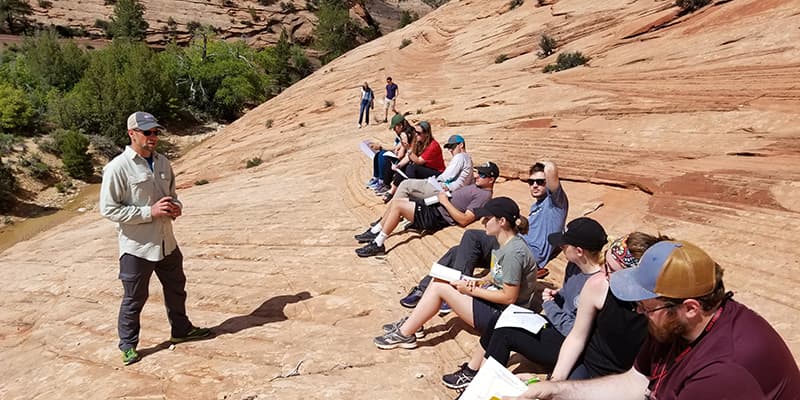 Students lean geology in field course.