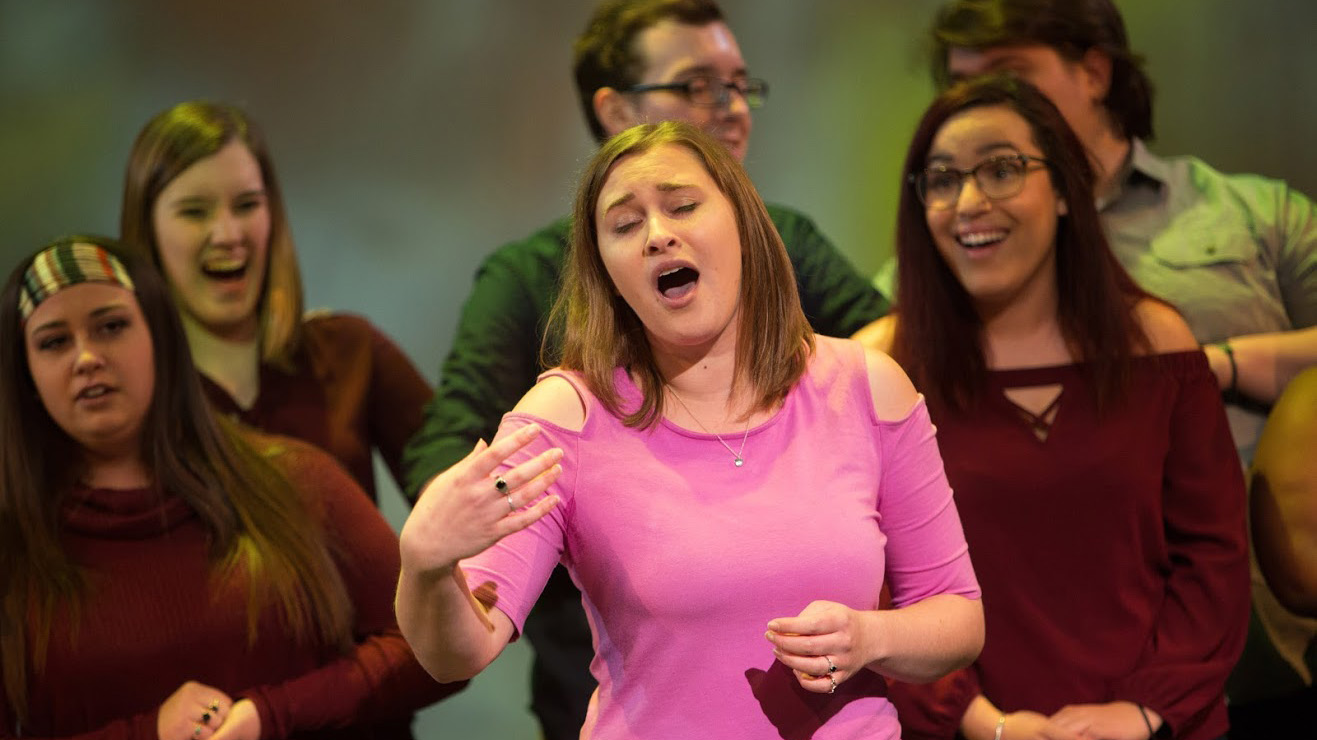 A musical theater major sings during a PennWest California performance.