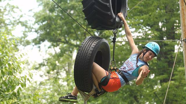 A student goes through an obstacle course.